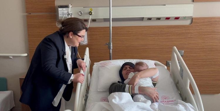 Earthquake survivor mother Yasemin Begdas reunites with her baby girl Vetin as Derya Yanik, Minister of Family and Social Services, looks on at a hospital in Adana, Turkey, on March 31, 2023. — Reuters