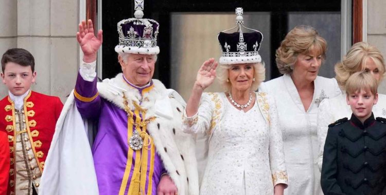 Britain's King Charles III and Queen Camilla wave to the crowds from the balcony of Buckingham Palace after their coronation ceremony in London on May 6.