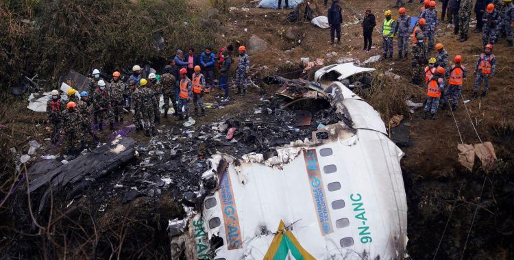 Rescuers scour the crash site in the wreckage of a passenger plane in Pokhara, Nepal, Monday, Jan.16, 2023.